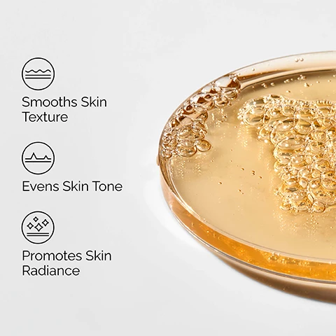 Image 1 - A golden liquid with many bubbles is shown in a shallow clear dish on the right, next to three icons with text reading Smooths Skin Texture, Evens Skin Tone, and Promotes Skin Radiance. Image 2 - A close-up of a persons face with a hand gently touching the cheek, featuring three text labels that read Brightens, Gently Exfoliates, and Smooths Skin Texture. Image 3 - An infographic on a white background displays three translucent drops of liquid, illustrating Key ingredients in Lactic Acid 5% + HA: Lactic Acid An Alpha Hydroxy Acid (AHA) which exfoliates for smoother-looking skin, and Hyaluronic Acid Supports skin hydration. Image 4 - The image displays a skincare regimen featuring four The Ordinary products: a grey tube of Squalane Cleanser for Prep that cleanses skin and removes makeup, two dropper bottles for Treat including Hyaluronic Acid 2% + B5 that hydrates and plumps the skin, and Lactic Acid 5% + HA that gently exfoliates for smoother skin, followed by a grey tube of Natural Moisturizing Factors + HA for Seal that supports the skin barrier, all under the heading A regimen for smooth, hydrated skin.