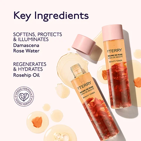 A cosmetic product image displays two By Terry Baume de Rose LEau de Beaute Beauty Toner bottles with rose petals inside, set among amber liquid droplets and scattered petals, accompanied by text that reads Key Ingredients SOFTENS, PROTECTS & ILLUMINATES Damascena Rose Water REGENERATES & HYDRATES Rosehip Oil and a vegan logo with VEGAN FORMULA VEGAN FORMULA.