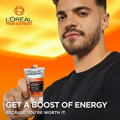 Image 3 - A man with a beard holds a tube of LOréal Men Expert Hydra Energetic Wake-Up Effect Face Wash, which has text reading New, Deep Cleans, Wakes Up The Skin, and Guarana + Vitamin C, against an orange and yellow background with the LOréal Paris Men Expert logo, accompanied by the phrases Get a boost of energy and Because youre worth it. Image 4 - A LOréal Men Expert Hydra Energetic Wake-Up Effect Face Wash tube is angled against a bright orange background with wavy patterns, promoting HYDRA ENERGETIC ENERGETIC FACE WASH and features including NEW LOREAL MEN EXPERT HYDRA ENERGETIC WAKE-UP EFFECT FACE WASH, DEEPLY CLEANSES PORES, INSTANT WAKE UP EFFECT ON SKIN, ENERGY BOOST WHEN TIRED, and GUARANA + VITAMIN C. Image 5 - A close-up shows a man with light eyes and fair skin touching his jawline against a bright orange and red background, with text that reads EASY TO USE, FRESHER FEELING SKIN, NON-GREASY, FOAMS WELL. Image 6 - A LOréal Men Expert Hydra Energetic Anti-Fatigue Moisturiser bottle and a swatch of cream are shown against an orange and yellow background with text that reads HYDRA ENERGETIC ANTI-FATIGUE MOISTURISER, FIGHTS 5 SIGNS OF FATIGUE: DRYNESS, DULLNESS, LOSS OF TONICITY, FINE LINES, DARK CIRCLES, and the bottle itself features LORÉAL PARIS MEN EXPERT HYDRA ENERGETIC ANTI-FATIGUE 24H MOISTURISER VITAMIN C + PROTEINS.