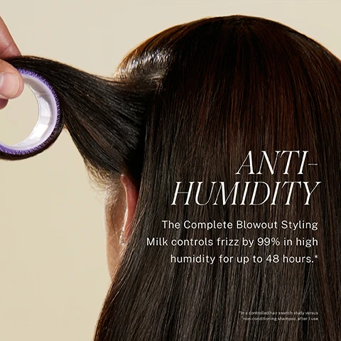 Image 1 - A person with long, shiny hair is holding a hair roller near their hair, and the text reads ANTI-HUMIDITY The Complete Blowout Styling Milk controls frizz by 99% in high humidity for up to 48 hours.*
Image 2 - A woman with long, straight hair rests her head back, while a round brush with black bristles is placed against her shiny hair, and text in the image reads, STYLE MEMORY Hair treated with Blowout Styling Milk maintains style for up to 48 hours* In a controlled hair swatch study versus non-conditioning shampoo, after 1 use.
Image 3 - A split image showing two women with different hairstyles; the woman on the left has curly hair and the woman on the right has straight hair, with visible text stating WITHOUT on the left and WITH: COMPLETE BLOWOUT STYLING MILK along with HAIR NOT RETOUCHED at the bottom.
Image 4 - A split image displays a woman with long gray hair; the left side shows her without styling and the right side shows her styled with defined waves, accompanied by visible text stating WITHOUT on the left and WITH: COMPLETE BLOWOUT STYLING MILK on the right, along with HAIR NOT RETOUCHED at the bottom.
Image 5 - A close-up of a hair straightener smoothing shiny, straight hair with the text that says SMOOTH and PROTECT, Hair prepped with Blowout Styling Milk was 5x smoother* and protected from heat up to 450°F*.
Image 6 - A person with long, wavy brown hair is shown from the side, with a blurred background of yellow foliage; the image contains text about a heat-activated styling milk, attributed to Jonathan Van Ness, celebrity hairstylist and founder of JVN Hair.
Image 7 - A series of three images showing a woman with long hair applying hair product, styling her hair, and using a hair dryer, with visible text detailing three steps: STEP 1 Apply 1-2 pumps in hands and rub together. STEP 2 Apply to hair starting with mid-shafts & ends and finishing with your roots. STEP 3 Blow dry, flat iron, curl or wave to your heart’s desire!