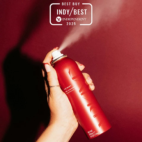 Image 2 - A hand with red-tipped nails holds a red dry shampoo can spraying mist, with a white badge above reading BEST BUY INDY/BEST INDEPENDENT 2025, and text on the can that reads THE RESET DRY SHAMPOO SHAMPOOING SEC NET WT. 200mL e 4.0 OZ (116g). Image 3 - The image shows a split-screen comparison of brown hair at the scalp: the left side labeled BEFORE, THE RESET, Dry Shampoo displays oily, flat roots, while the right side labeled AFTER, THE RESET, Dry Shampoo shows clean, volumized roots. Image 4 - An image shows a red dry shampoo can on the right against a dark red background, with white text on the left detailing product usage instructions and tips. The text reads: HOW TO USE: Shake well before use. Holding 10cm away, section hair and spray directly into roots. Let sit for 30 seconds then remove by massaging with fingertips or brushing through hair. TOP TIPS: For a lighter refresh, spray onto a brush and pass through hair. Apply before bed to soak up excess oil and sweat. Brush through in morning. The dry shampoo can itself displays: THE RESET DRY SHAMPOO SHAMPOOING SEC NET WT. 200mLe 4.0 OZ (116g). Image 5 - A red dry shampoo can is centrally placed amidst natural ingredients, including a red heirloom tomato, a yellow-green stalk, a flowering vine with white blossoms, and red berries, with text on the can reading THE RESET DRY SHAMPOO SHAMPOOING SEC NET WT. 200mL e 4.0 OZ (116g), and claims of Modified starch absorbs excess oil & sweat and Baobab Oil softens hair & scalp, plus a VEGAN logo. Image 6 - The image shows two red heirloom tomatoes, a stalk of rhubarb, a cluster of red currants, and honeysuckle flowers and leaves on a light background, with the text SMELLS LIKE: NO ONE ELSIE, A fresh and elevated fragrance inspired by Adams grandmothers English greenhouse. HEAD NOTES RHUBARB TOMATO LEAF HEART NOTES HONEYSUCKLE REDCURRANT GROUND NOTES VETIVER INCENSE. Image 7 - A hand sprays a mist from a red dry shampoo can labeled THE RESET DRY SHAMPOO SHAMPOOING SEC, NET WT. 200ml e 4.0 OZ (116g) BY AD, surrounded by red tomatoes, flowers, rhubarb, and red currants on a red surface, with additional text MADE WITHOUT: AMMONIA LACTOSE LATEX MINERAL OIL SILICONE SULPHATE GLUTEN TALC PARABENS, and icons indicating VEGAN, Certified B Corporation, MADE WITH RECYCLED CONTENT, Cruelty Free International, and AWARD WINNING.