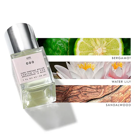 Image 1 - A clear glass perfume roller bottle with a silver cap is positioned at an angle beside three horizontal swatches featuring a slice of lime, a water lily flower, and a piece of wood, labeled with the scents bergamot, water lily, and sandalwood, respectively, and includes the text PURE PERFUME ROLLER and 1 FL OZ US - 30 ML.