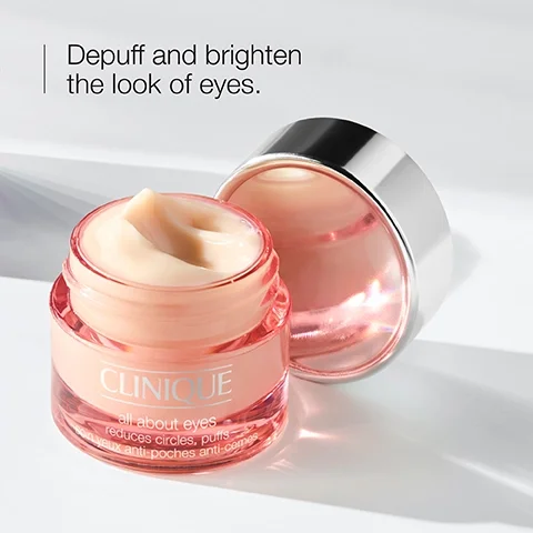 Image 1 - A jar of Clinique eye cream is shown with a creamy product visible inside, alongside text that reads Depuff and brighten the look of eyes and all about eyes reduces circles, puffs.