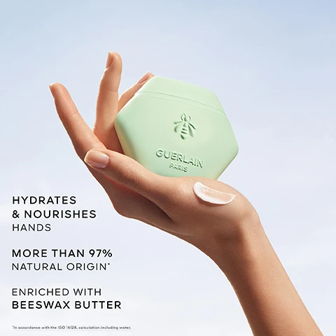 Image 1 - A hand holds a light green hexagonal container of Guerlain hand cream against a clear blue sky, with visible text stating HYDRATES & NOURISHES HANDS, MORE THAN 97% NATURAL ORIGIN, and ENRICHED WITH BEESWAX BUTTER.
Image 2 - An overhead view of pink rose petals and cucumber slices floating in water with droplets, featuring the text ROSE, CUCUMBER, MINT.
Image 3 - A green hexagonal container labeled Guerlain Paris is shown next to a bottle of Aqua Allegoria Rosa Verde, which features a gold honeycomb cap, all against a bright backdrop with the text ROSA VERDE SCENTED RITUAL in the upper left corner.