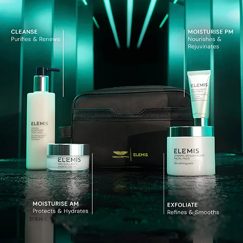 A collection of Elemis skincare products including a facial wash, creams, and facial pads, alongside a black wash bag featuring Aston Martin F1 Team and Elemis logos, is shown with accompanying text describing functions: CLEANSE Purifies & Renews, MOISTURISE PM Nourishes & Rejuvenates, MOISTURISE AM Protects & Hydrates, EXFOLIATE Refines & Smooths.