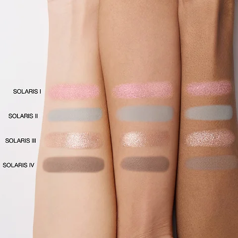 Three arms with fair, medium, and dark skin tones display four horizontal swatches of eyeshadow: shimmery pink, matte light grey, shimmery champagne, and matte brown, labeled SOLARIS I, SOLARIS II, SOLARIS III, SOLARIS IV.