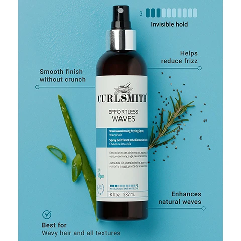 Image 1 - A Curlsmith Effortless Waves Wave Awakening Styling Spray bottle, brown with a silver top and a white and blue label, is featured on a light blue background next to an aloe vera leaf and a rosemary sprig, with surrounding text that reads Smooth finish without crunch, Helps reduce frizz, 3 Invisible hold, Enhances natural waves, and Best for Wavy hair and all textures; the product label itself displays CURLSMITH EFFORTLESS WAVES Wave Awakening Styling Spray Wavy Hair Spray Coiffant Embellisseur De Vagues Cheveux Bouclés, ingredient lists including linseed extract, chia extract, squalene, aloe vera, rosemary, sage, resurrection flower, extrait de lin, extrait de chia, squalane, aloe vera, romarin, sauge, plante de la résurrection, a Vegan logo, INVISIBLE HOLD / TENUE INVISIBLE 3, and 8 fl oz 237 mL. Image 2 - A hand sprays a black and white Curlsmith Effortless Waves Wave Awakening Styling Spray bottle, with text on a blue background reading Reduces frizz by 78%* and the bottle also shows 5 fl oz 237 mL. Image 3 - A smiling woman with long, curly hair holds a Curlsmith Effortless Waves spray bottle against a light blue background, with text stating 86% agreed their waves were more defined after using this product*. Image 4 - A smiling woman with blonde, curly hair holds a spray bottle, with text next to her that reads 87% felt this product was perfect for naturally wavy hair*. Image 5 - An image features two Curlsmith Effortless Waves Wave Awakening Styling Spray bottles, the left bottle shows the old packaging with an orange label displaying Curlsmith Moisture Recipes Effortless Waves Wave Awakening Styling Spray Wavy Hair Invisible hold / tenue invisible 3 Vegan 8fl oz 237ml, and the right bottle shows the new packaging with a blue label displaying Curlsmith Effortless Waves Wave Awakening Styling Spray Wavy Hair Invisible Hold / Tenue Invisible 3 Vegan 8fl oz 237ml, an arrow points between them, and a teal badge at the top right states Same Great New Look Product.